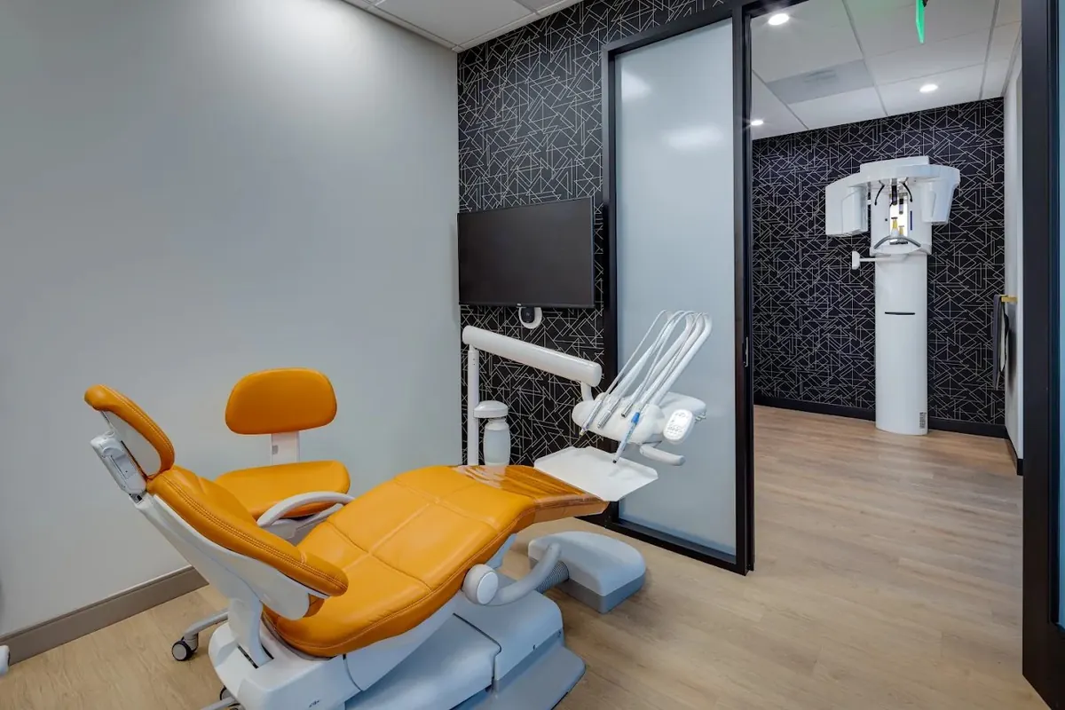 Treatment room with a dental chair and imaging unit at Oak Tree Dental in Poway, CA